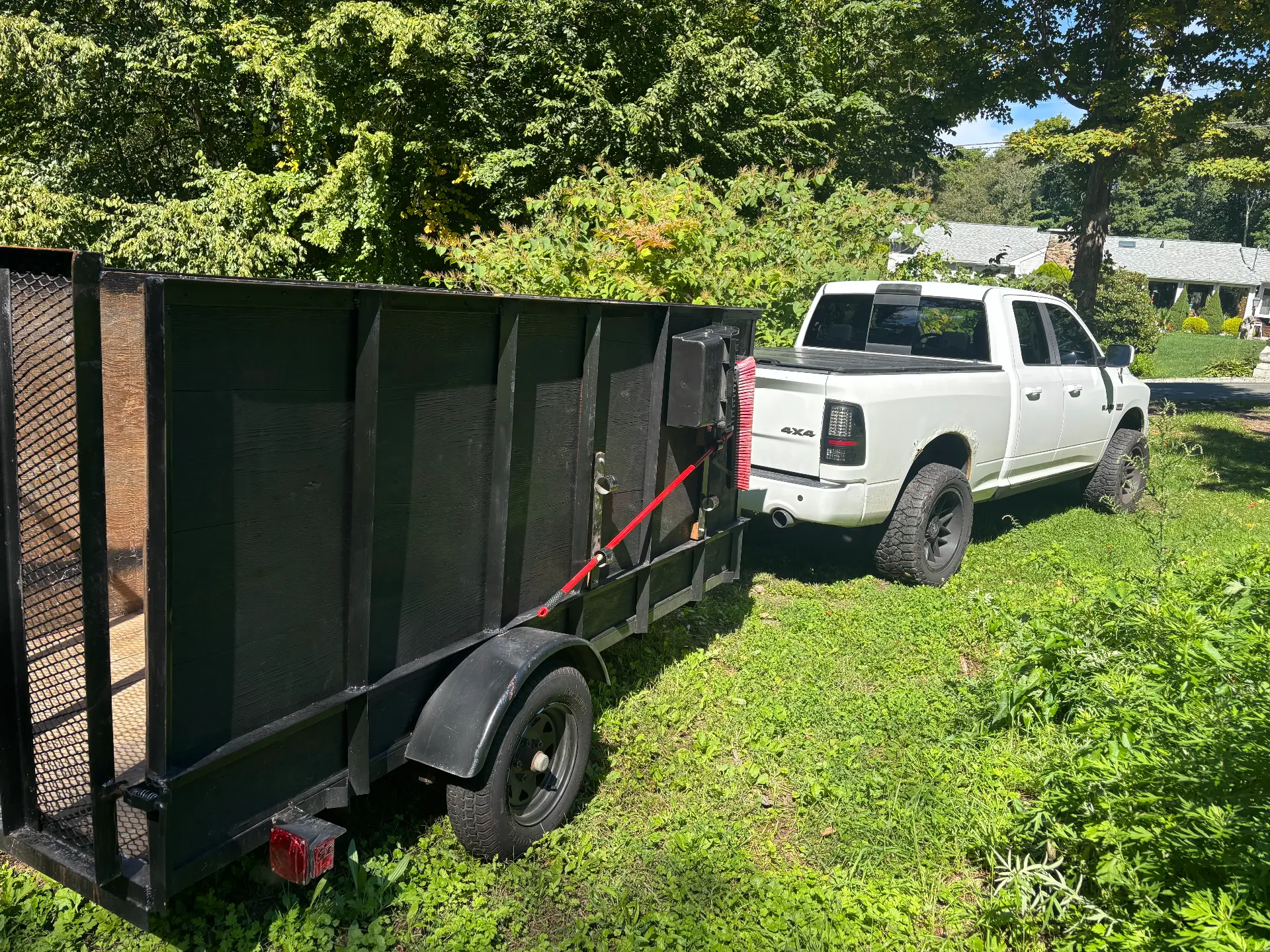 Load and Go junk removal truck and high-side trailer rear view in Oxford Connecticut