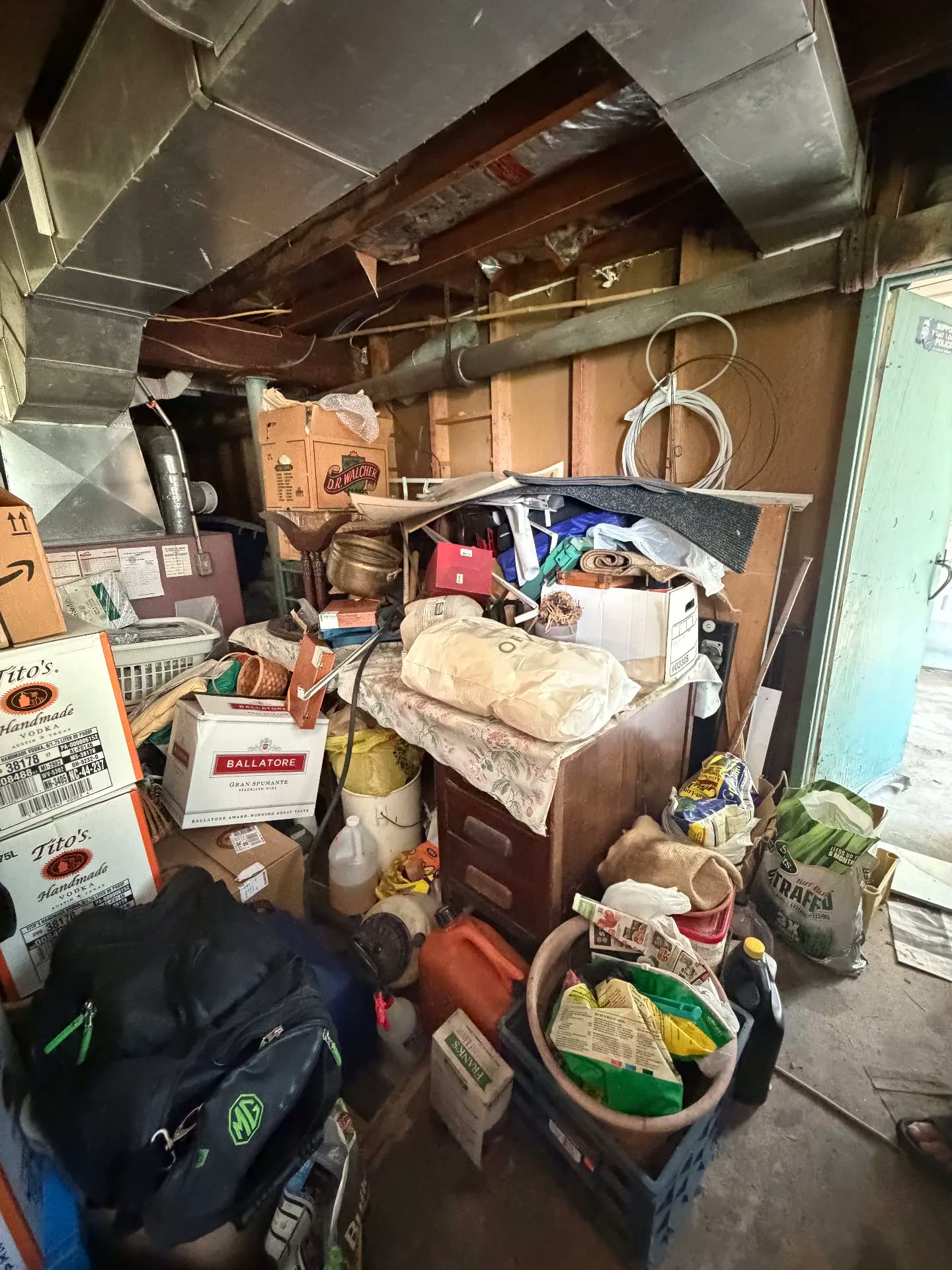 Basement corner piled with boxes before cleanout
