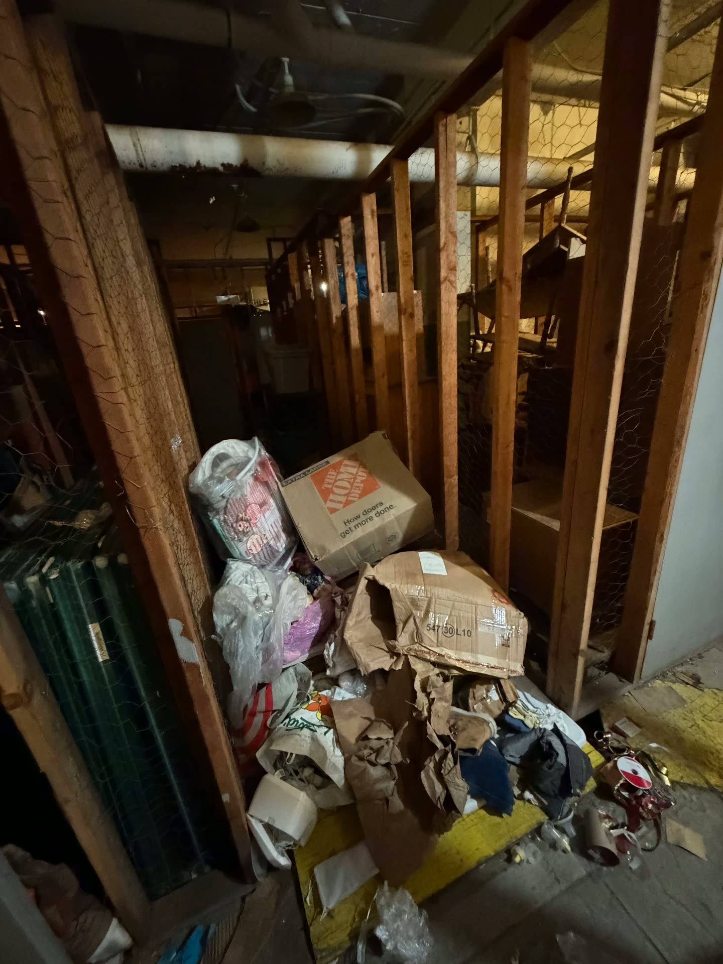 Storage aisle packed with bags and boxes after flooding