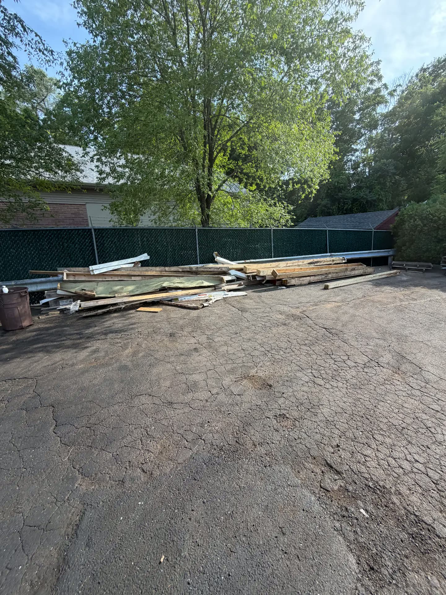 Pile of lumber and construction debris before cleanup