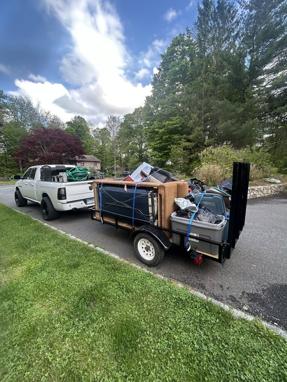 Load & Go truck and trailer both fully loaded after a cleanout job in CT
