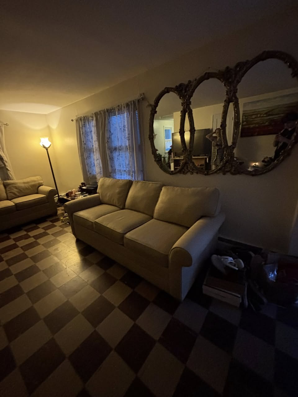 Living room completely clear after move-out cleanout — couches removed